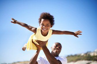 father playing with daughter