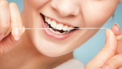woman flossing