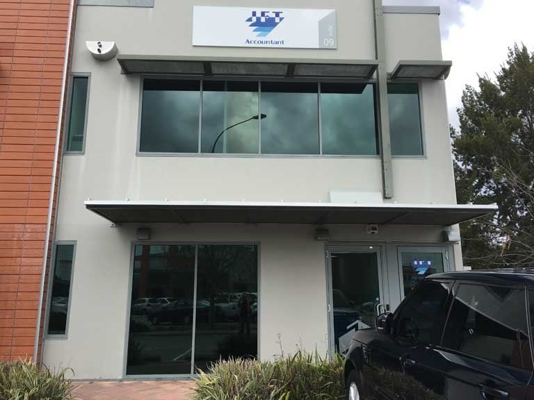 business front with tinted windows