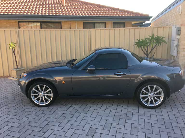 car with tinted windows, side view