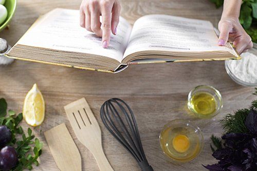 Woman Reading A Cookbook