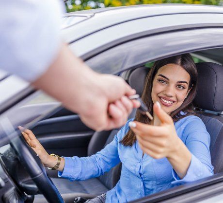 Teen in Car Being Handed Keys