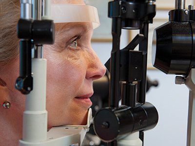 Women Receiving Eye Exam - Optometrist in Methuen, MA Women Receiving Eye Exam - Optometrist in Methuen, MA