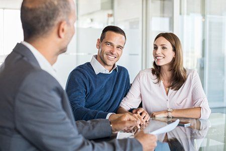 Insurance Agent — Agent Talking To Couple in Pierce FL Insurance Agent — Agent Talking To Couple in Pierce FL