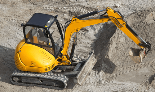 High angle view of yellow mini excavator