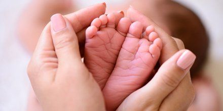 Obstetric Care — Mother Holding Foot Of Her Child in Laredo, TX Obstetric Care — Mother Holding Foot Of Her Child in Laredo, TX