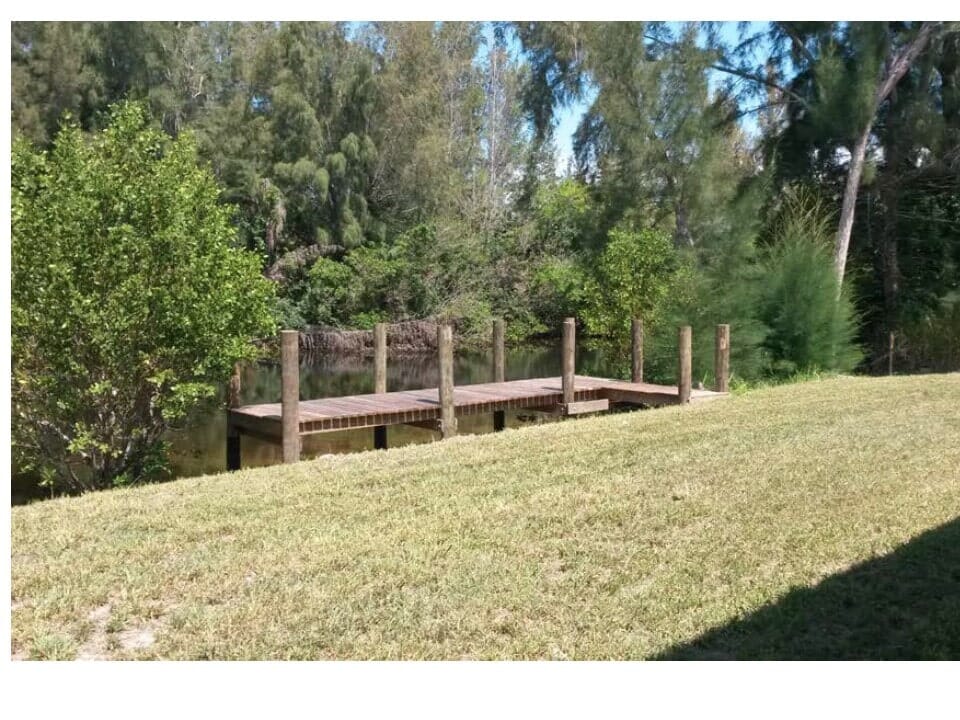 Pressure treated wood dock and access way for narrow canal