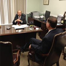 Mark Hanlon and Robert Zubkus seated around a desk