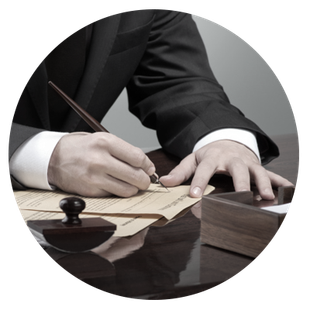 Lawyer using a calligraphy pen to write on a document