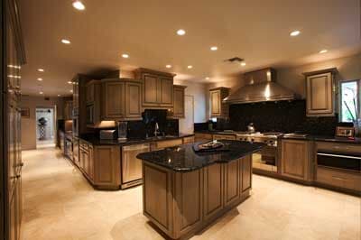 A large kitchen with a large island in the middle