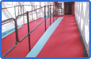 For floor fitters in Rochford call 01702 417 578 red carpet tiles along a public walkway