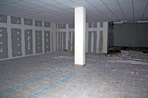basement renovation with drywall installed and plastered ready to be painted. flooring ready to be installed.