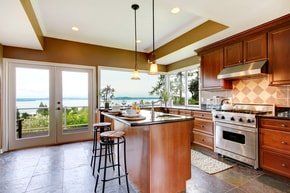 luxurious wooden renovation for a home's kitchen. over looking the mountain view. big kitchen all wood flooring and cabinets.
