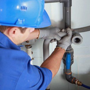 Plumber installing pipes Plumber installing pipes