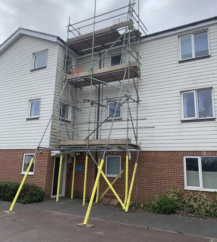 large house with scaffold with a garden 9