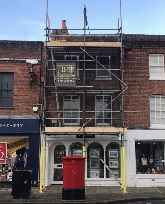 large house with scaffold with a garden 10
