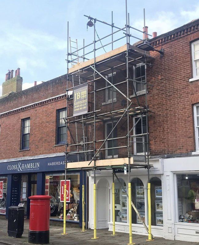 large house with scaffold with a garden 11