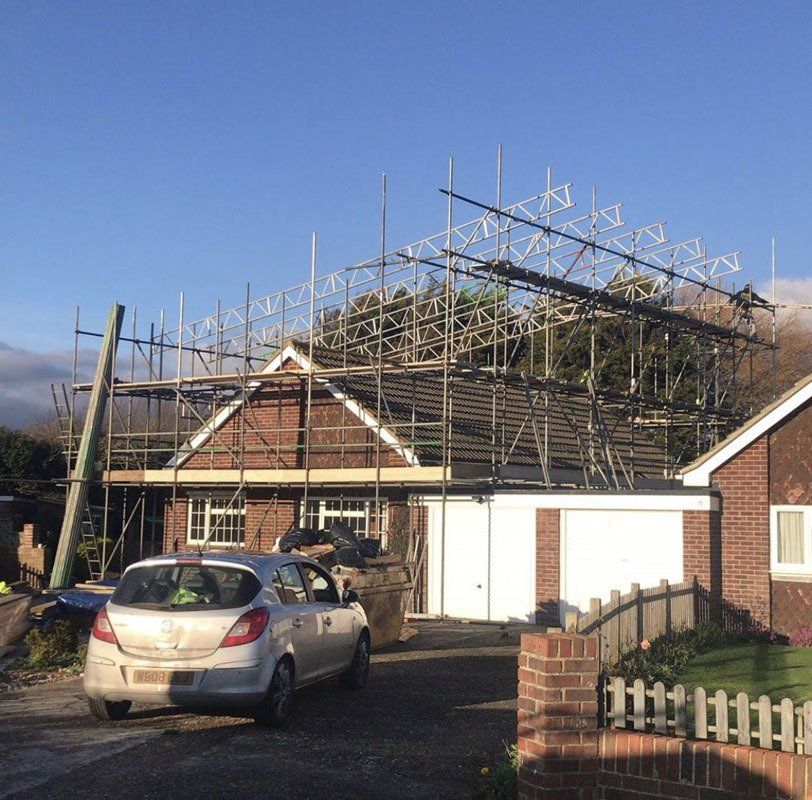 large house with scaffold with a garden 4