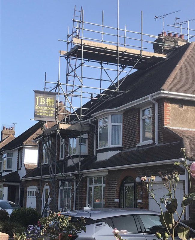 large house with scaffold with a garden 5