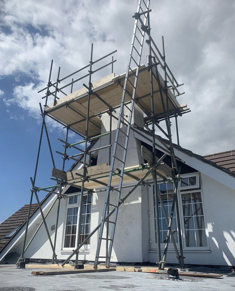 large house with scaffold with a garden 7