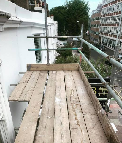scaffold on a white house from up high
