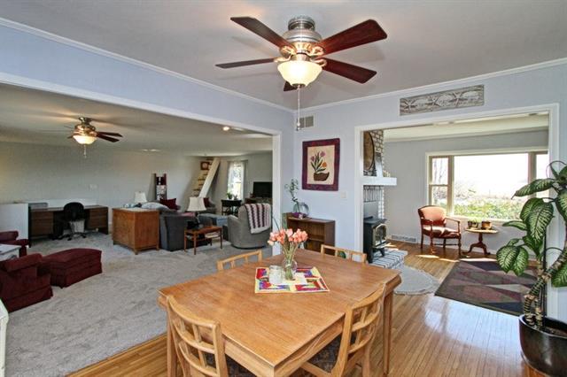 ceiling fan with table and flowers