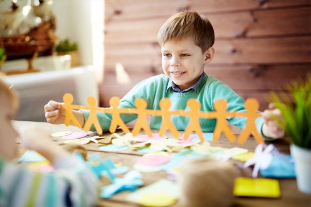 a kid with paper cuts