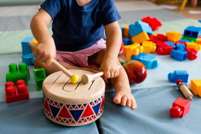kid playing drums