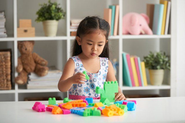 kid playing lego
