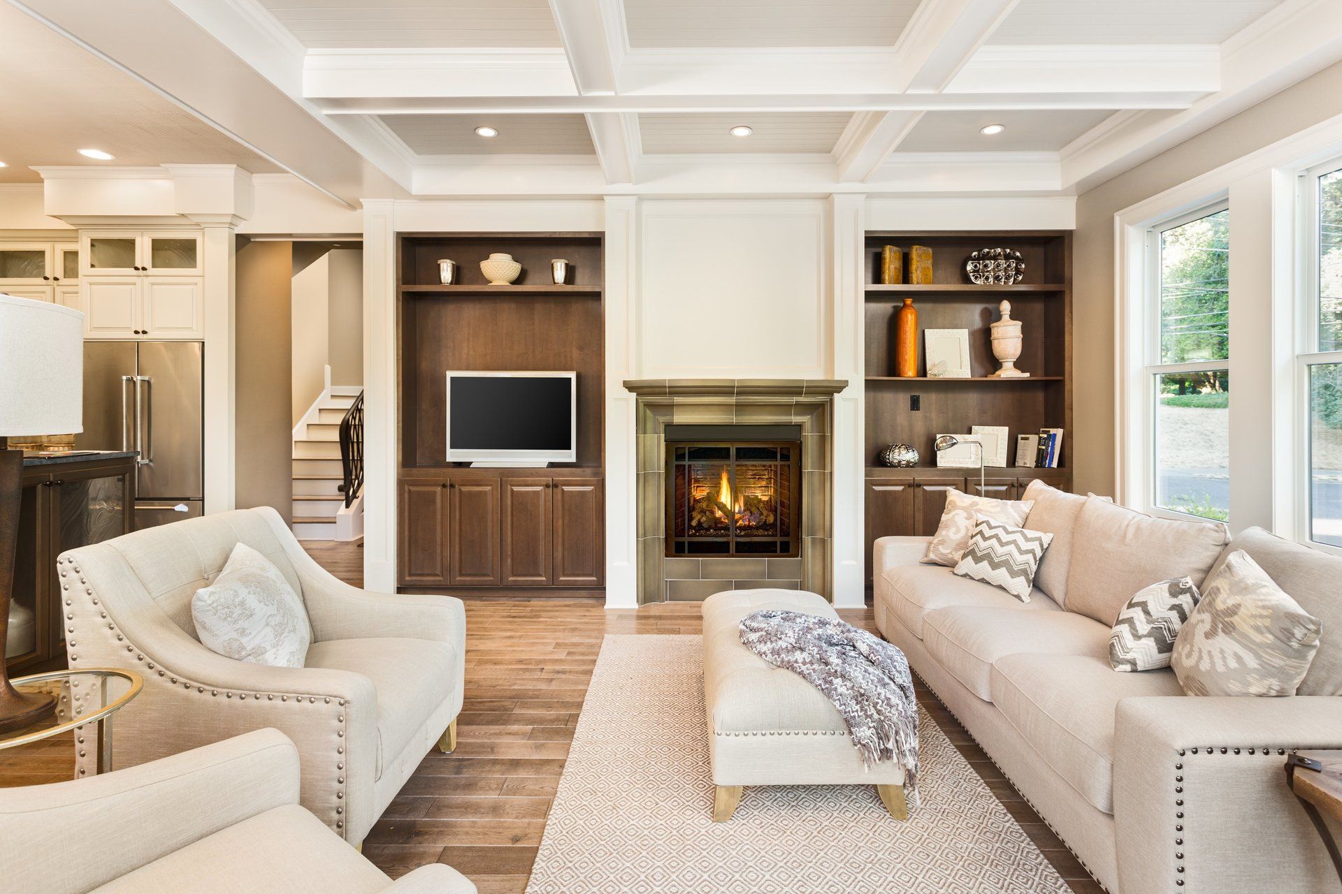 A living room filled with furniture and a fireplace.