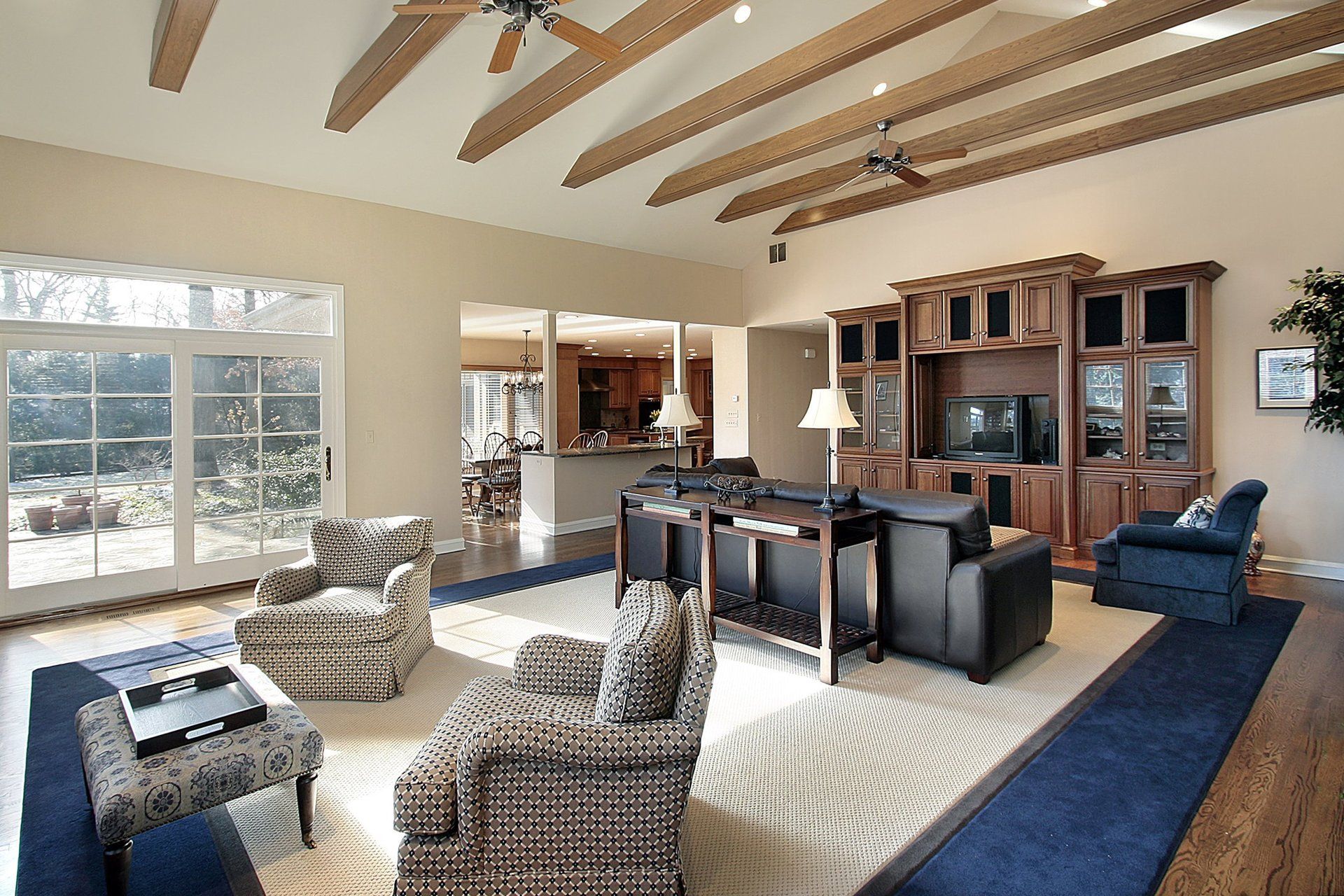 A living room filled with furniture and a ceiling fan
