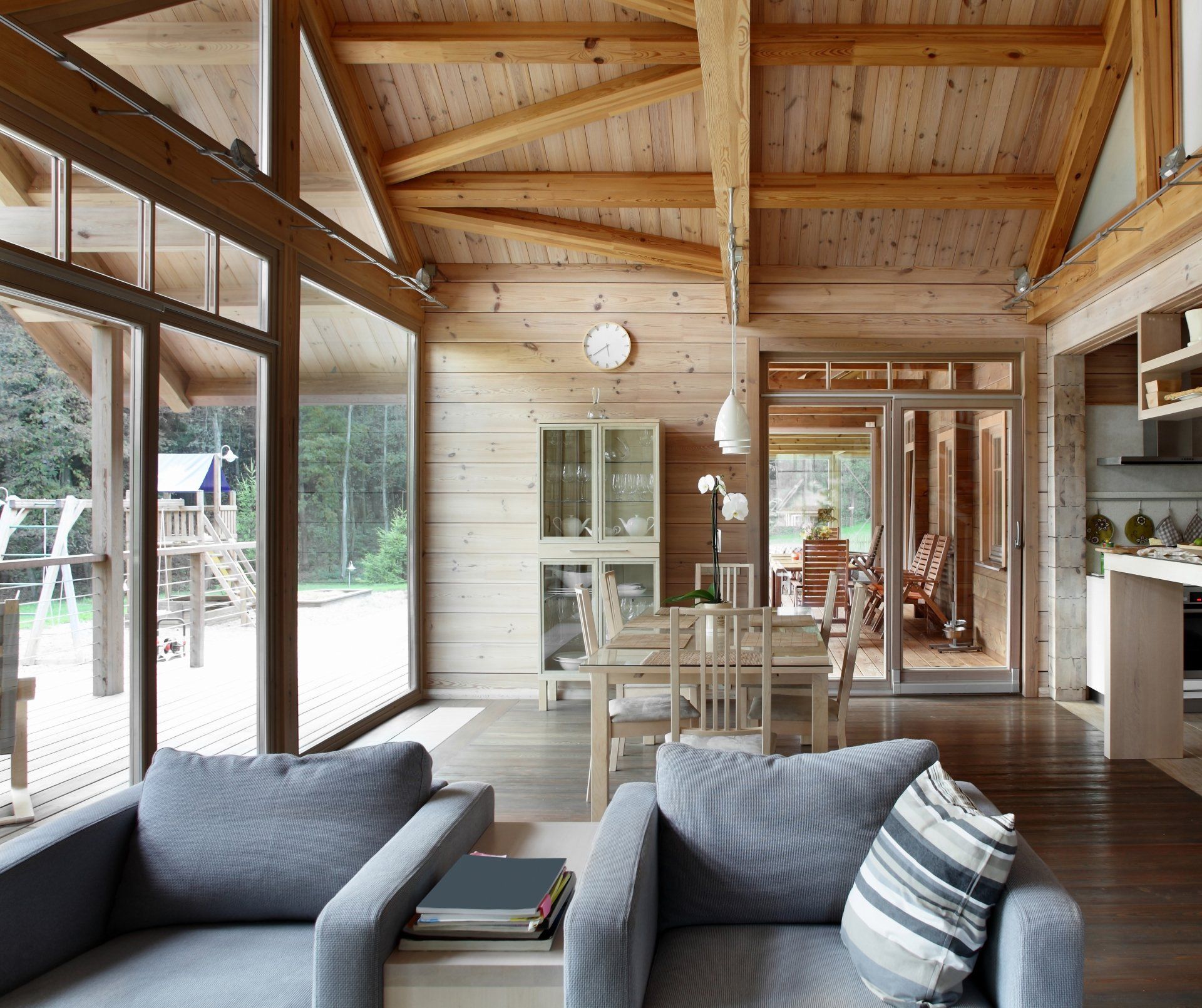 A living room with a couch and chairs in it