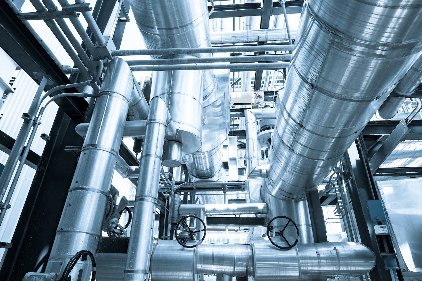Top floor of boiler or Heat Recovery Steam Gas of combined cycle power plant against blue sky