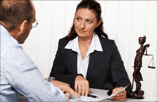 If you need legal help in Belfast call 028 9002 7160 Lady and man looking at contract