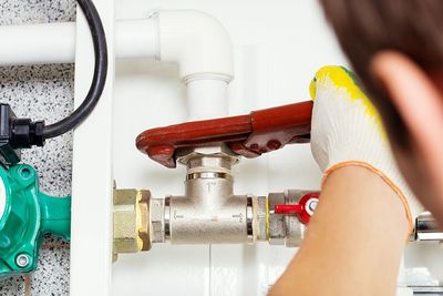 Plumber Repairing Pipes — Plumbing Services in Cheyenne, WY Plumber Repairing Pipes — Plumbing Services in Cheyenne, WY
