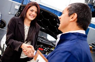 a customer shaking hands with a mechainics