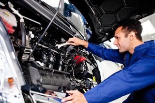 a car under maintenance by a mechainic