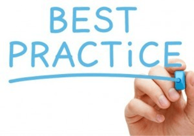 a person is writing the word best practice with a marker
