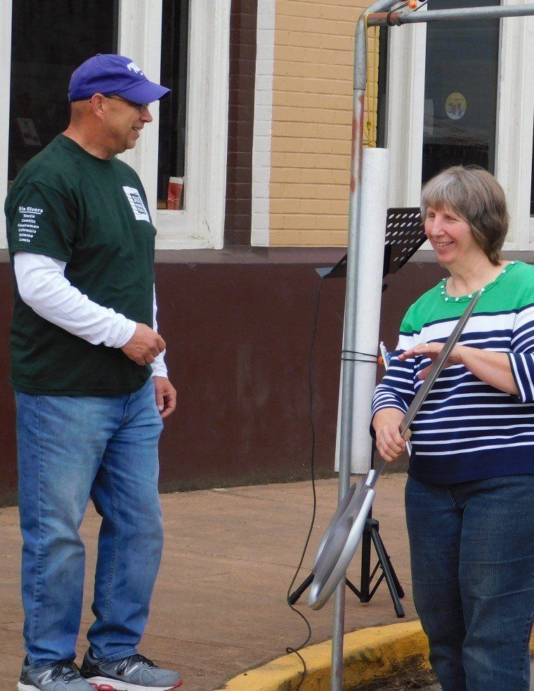 a man and a woman are standing next to each other