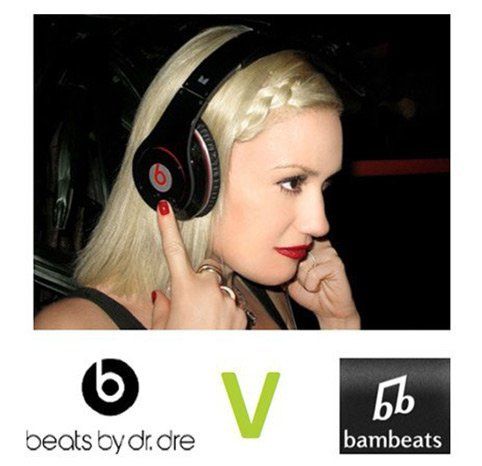 A woman wearing a pair of beats by dr dre headphones