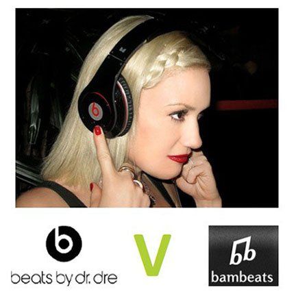 A woman wearing a pair of beats by dr dre headphones