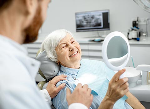 Elderly Woman in the Dental Office — Grand Rapids, MI — Dentures In a Day Elderly Woman in the Dental Office — Grand Rapids, MI — Dentures In a Day