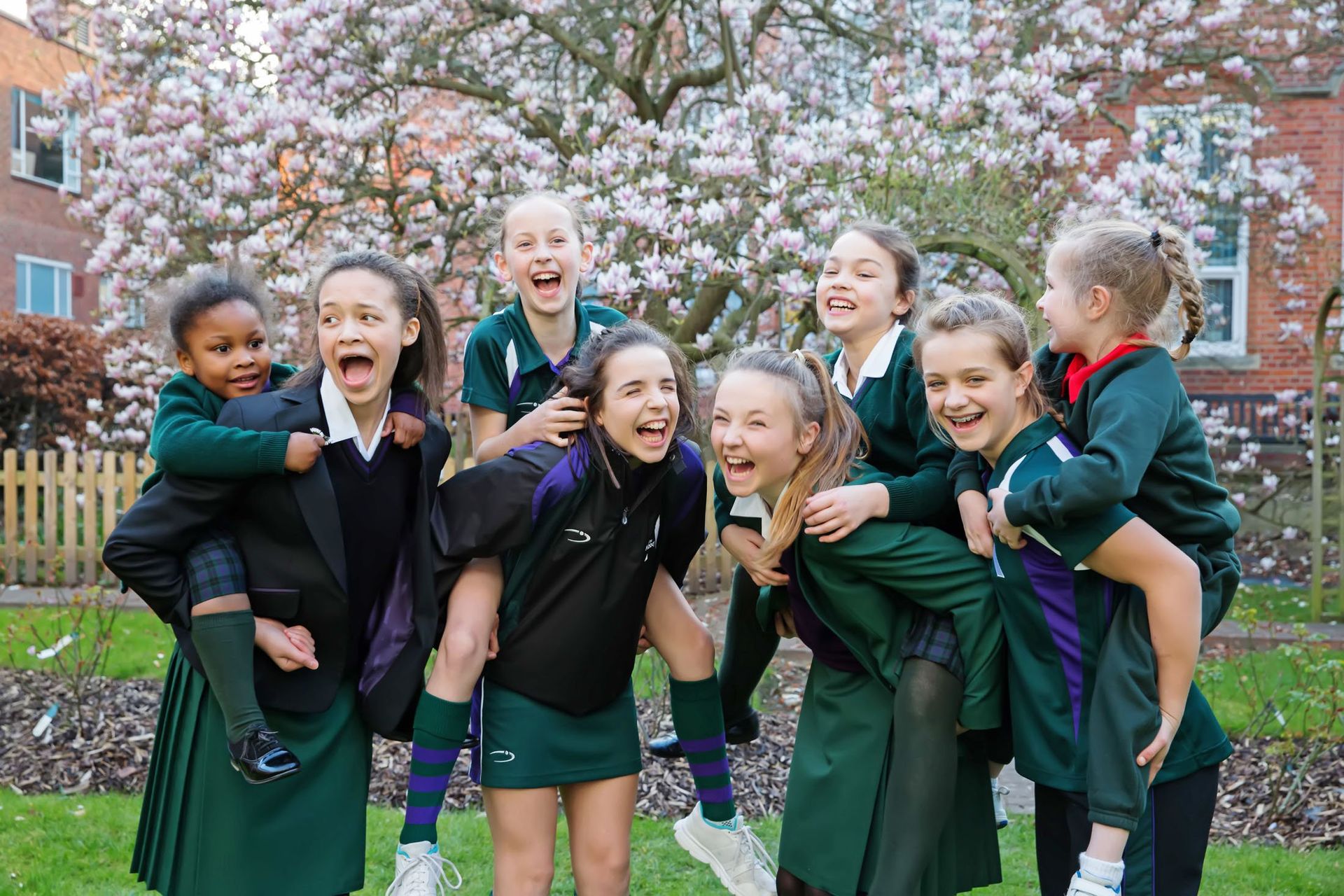 school marketing Photography Reading, female students piggy backs
