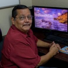 CARLOS MONTEJANO Carlos Montejano, sitting at a desk.