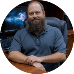 JASON HENDERSON Jason Henderson, sitting at a desk.