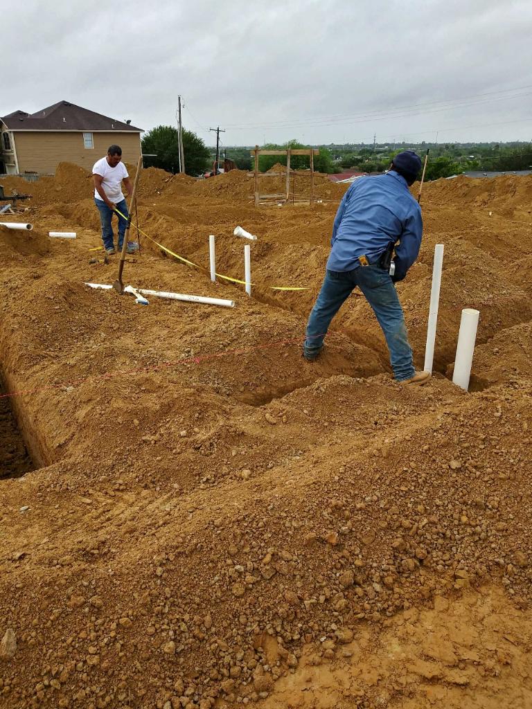 Home Plumbing — Plumber Fixing a Pipe in Laredo, TX