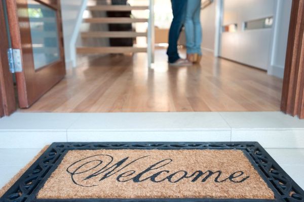 Happy young couple standing inside their new house
