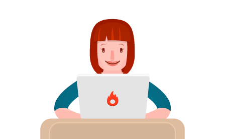 Uma mulher está sentada em uma mesa usando um laptop.