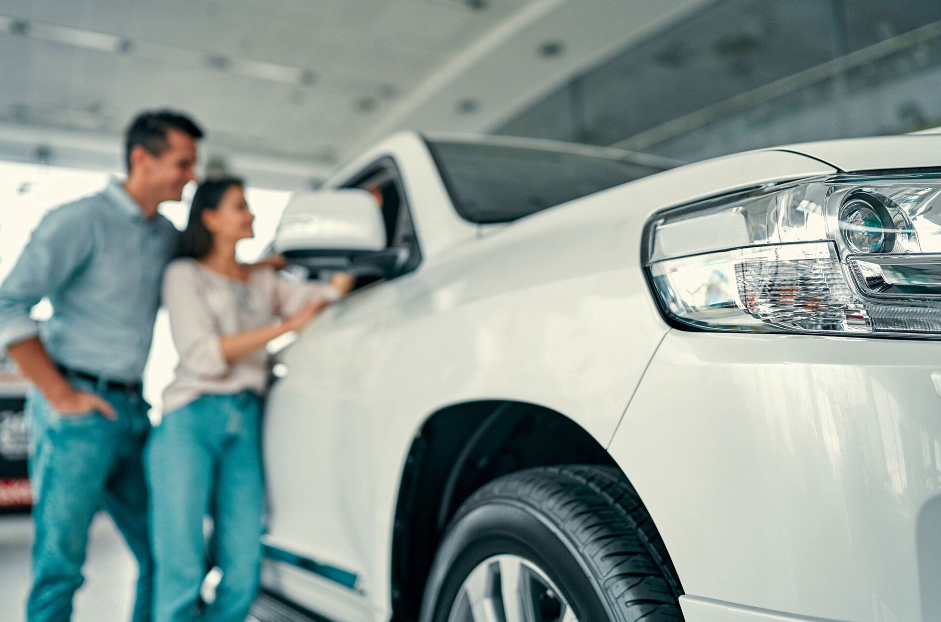 Happy Couple and White Car — Gautier, MS — Coastal Insurance Associates, Ltd