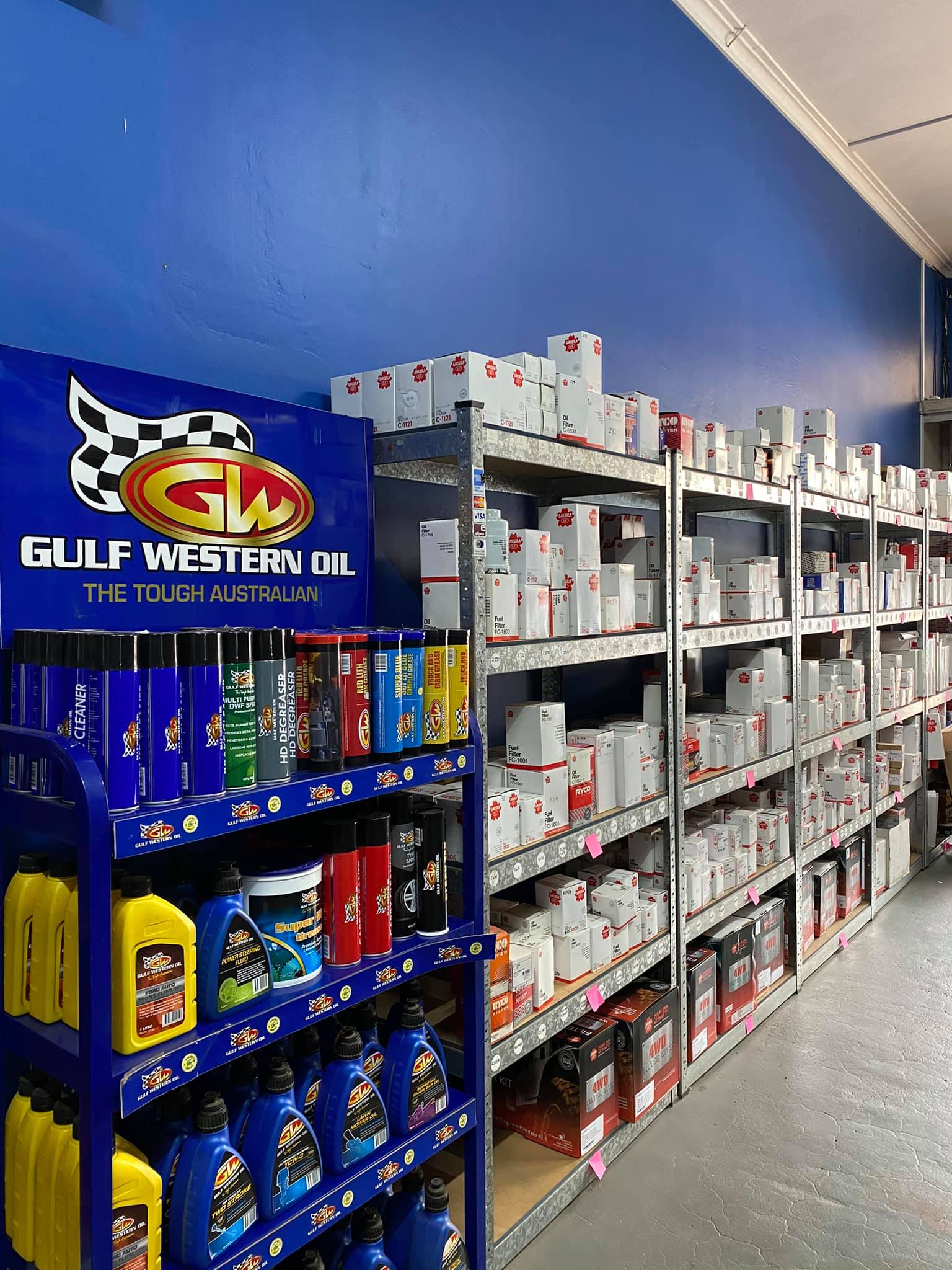 A Store Filled With Lots of Shelves and Bottles of Oil — Mayne Street Auto in Gulgong, NSW
